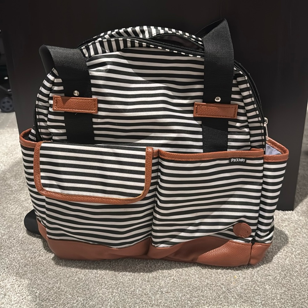Black and white striped Diaper bag with several pockets